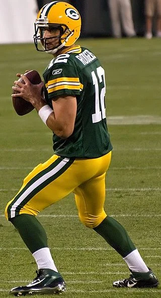 Aaron Rodgers’ left Achilles tendon just got a whole lot more tender after Ndamukong Suh stepped on it.&nbsp;Photograph by Mike Morbeck.