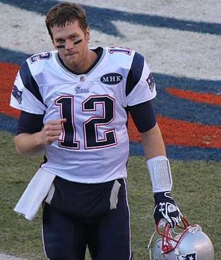 Russell Wilson, hoisting the Lombardi Trophy last year, and Tom Brady are both featured in the superb new “Sports Illustrated NFL QB.” Brady photograph by Jeffrey Beall