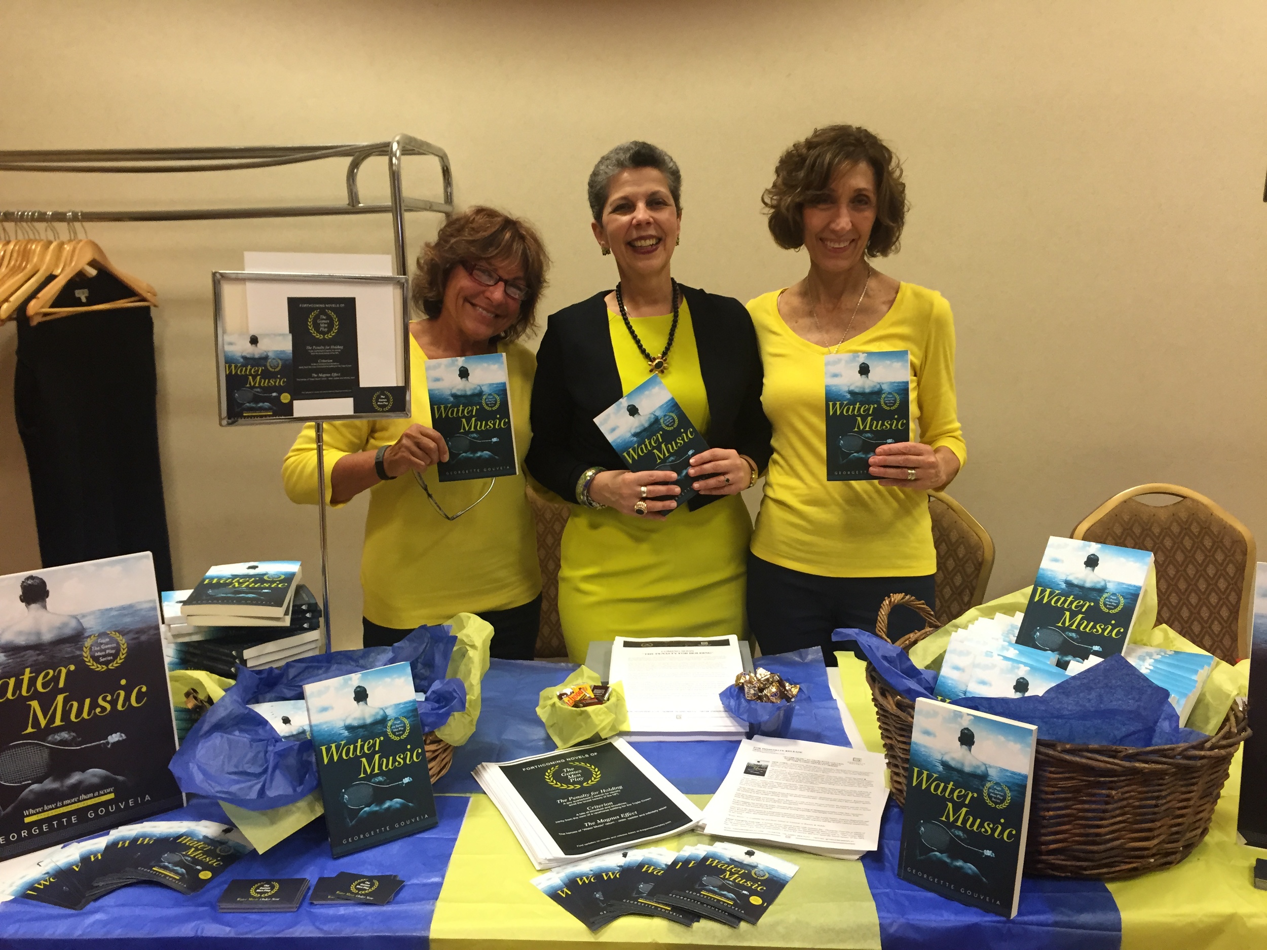  With friends, helpers and "bookends" Wendy Pandolfi (left) and Mary Azzuriti. "We popped," Mary said of the vibrant color scheme reflecting "The Games Men Play" brand. 