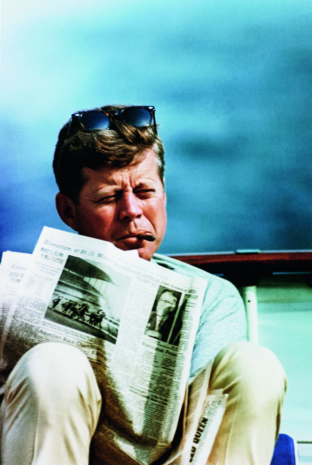   © The Stylish Life - Yachting, published by teNeues, www.teneues.com. John F. Kennedy with Newspaper and Cigar, Photo © CORBIS.  