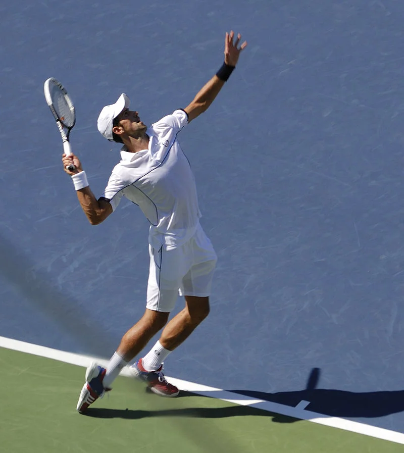 Novak Djokovic in Wimbledon white. Who says he doesn’t have beautiful form?