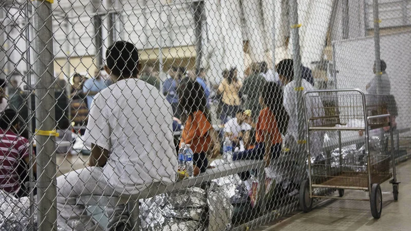 A photo provided by U.S. Customs and Border Protection shows people detained at a facility in McAllen, Texas, on Sunday. Image here . 