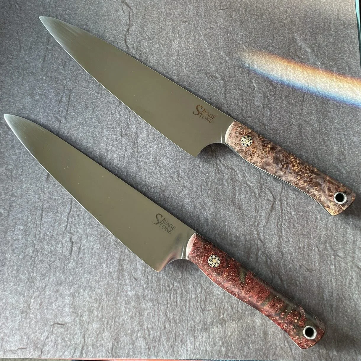 Last ones of the year: locally commissioned pair of chefs for a pair of brothers. 8&rdquo; Gyoto profile blades in Nitro-V wearing dyed box elder burl from @robswildwood; black micarta and ivory G10 liners; custom stainless, brass and copper mosaic p