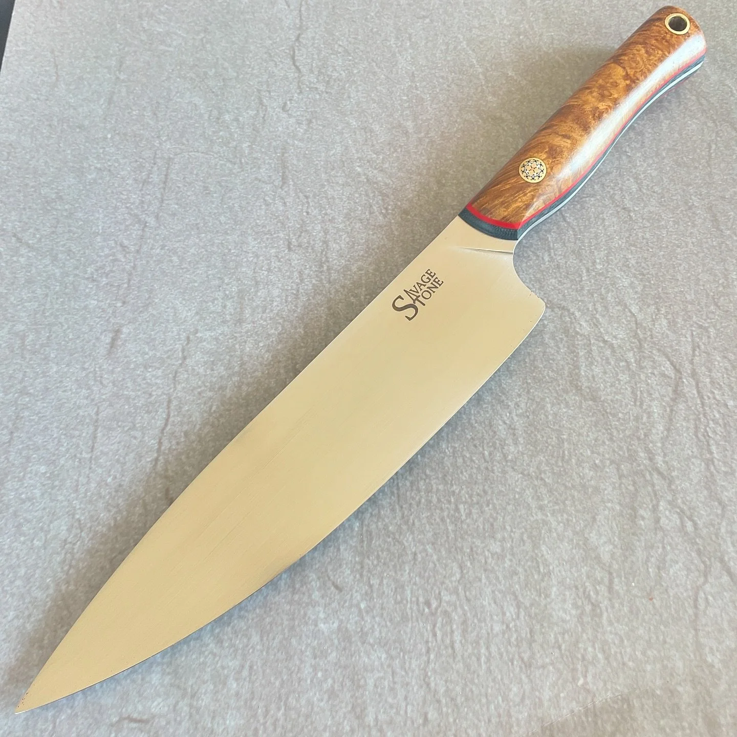 *GONE* commissioned 8.5&rdquo; chef in Nitro-V wearing Lamtoro burl from @robswildwood, navy canvas micarta and red G10; brass, stainless and copper pins; maple and poplar saya. Thanks for taking a gander! More to come 🔪&mdash;&mdash;&mdash;&mdash;&