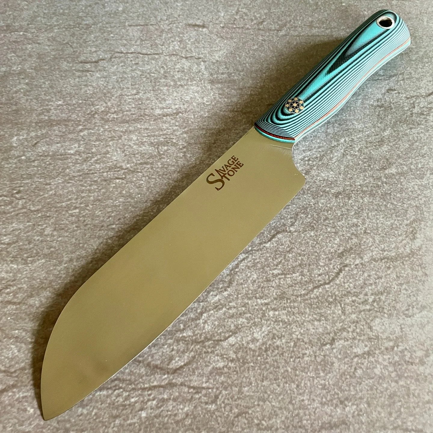 *GONE* 6&rdquo; Santoku commission in CPM-Magnacut wearing turquoise and black layered G10, brown micarta and turquoise G10 liners; stainless and brass mosaic; maple and polar saya. Headed up north as a wedding gift from some amazing, long-time suppo