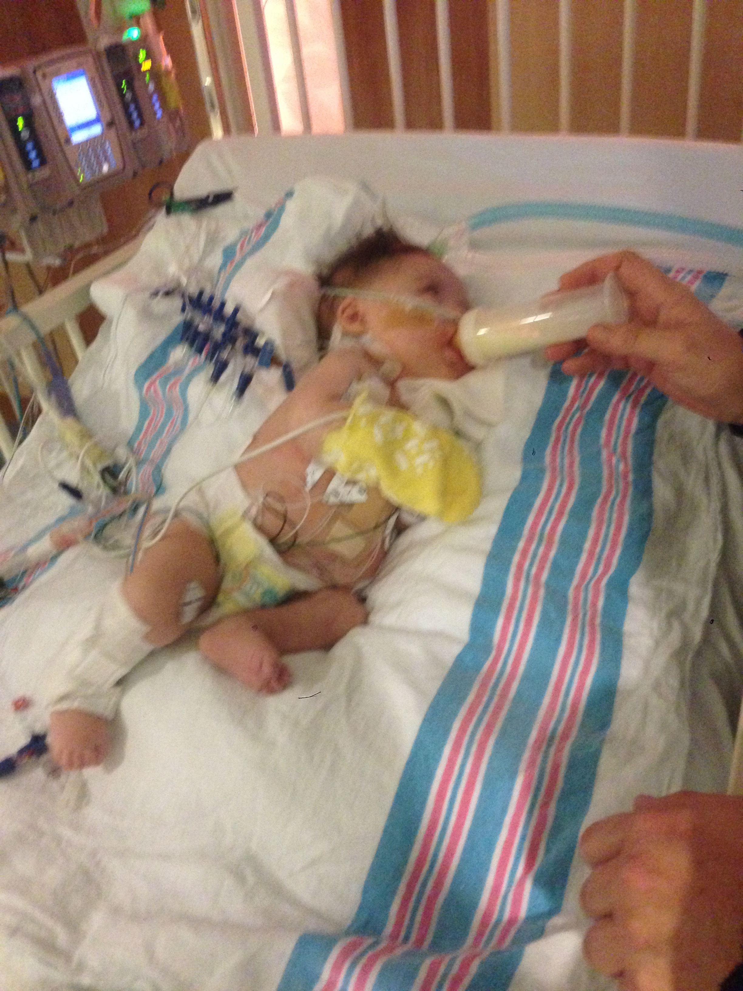 10/31/14 // 2mo daddy bottle feeding me post-op