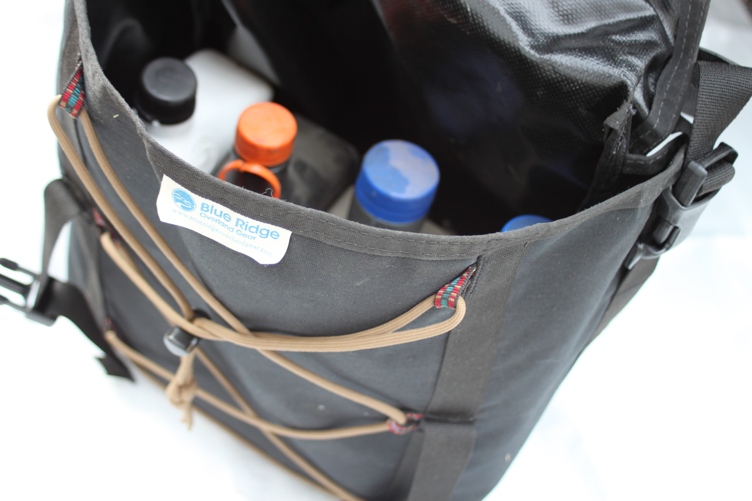 The Overland Oil Bag pictured with some fluids I like to keep handy on each trip.