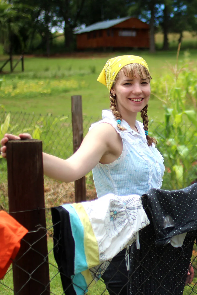 Emily helped wash and dry laundry. The clothes were hung outside and sun dried. The students learned how difficult life might be without the conveniences of home, such as an electric clothes dryer.