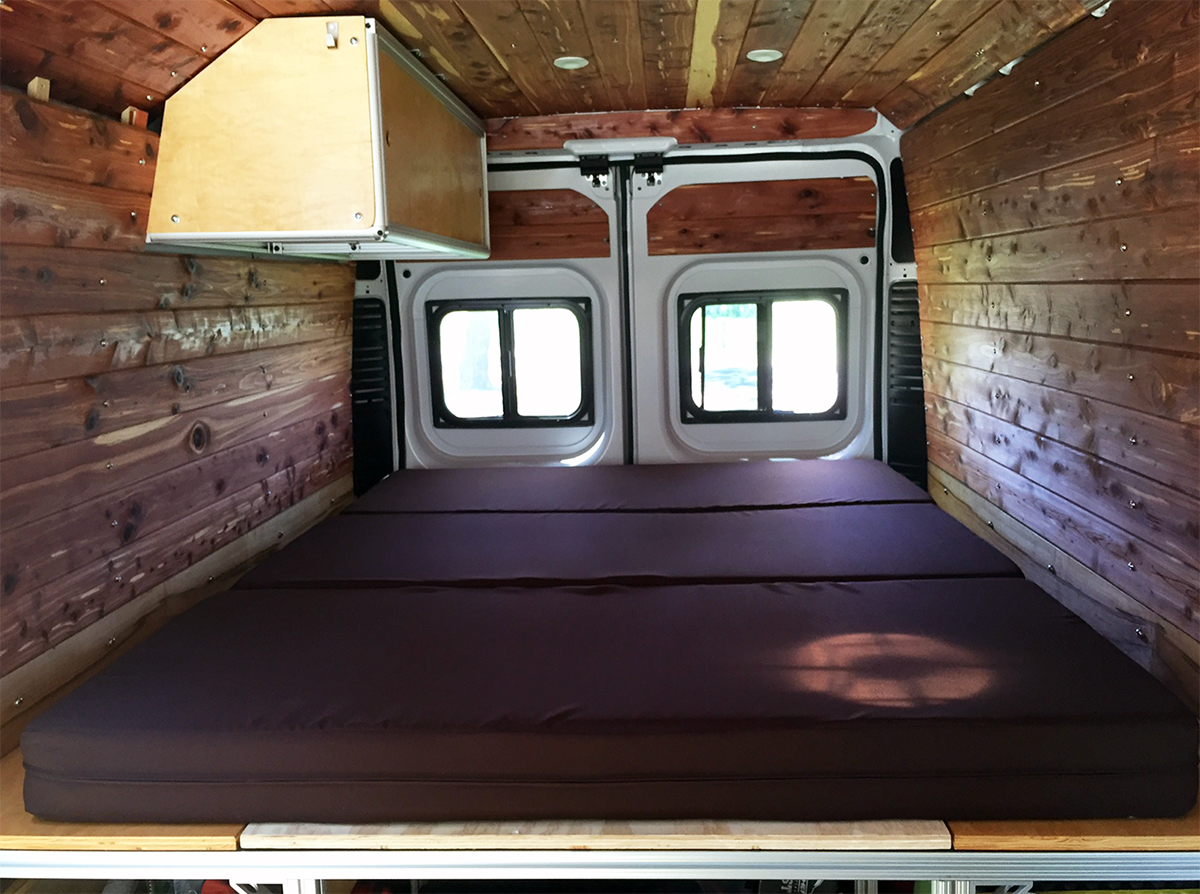Our shikibuton. Notice the two folds. Eventually, we'll flip up the foot -- closest end in photo -- to reveal our table and bench seats.