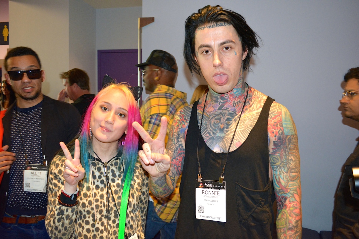 Saying "hi" to Ronnie Radke. The man in the background makes this picture. NAMM 2015.