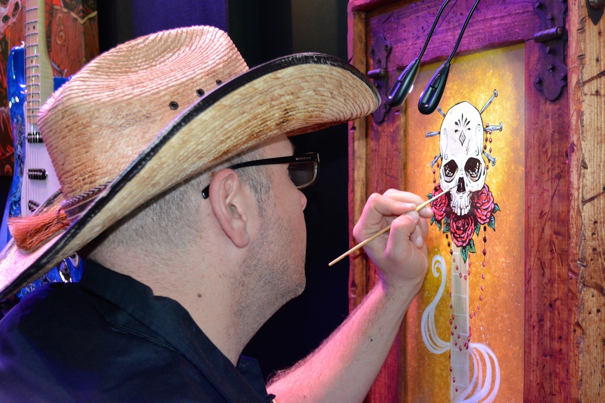 "Lil' Devils Want To Rock" artist, live painting in the Fender room. NAMM 2015. ©WoTR Radio