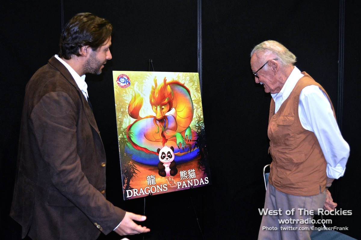 Terry and Stan admiring the Dragons Vs. Pandas cover art.