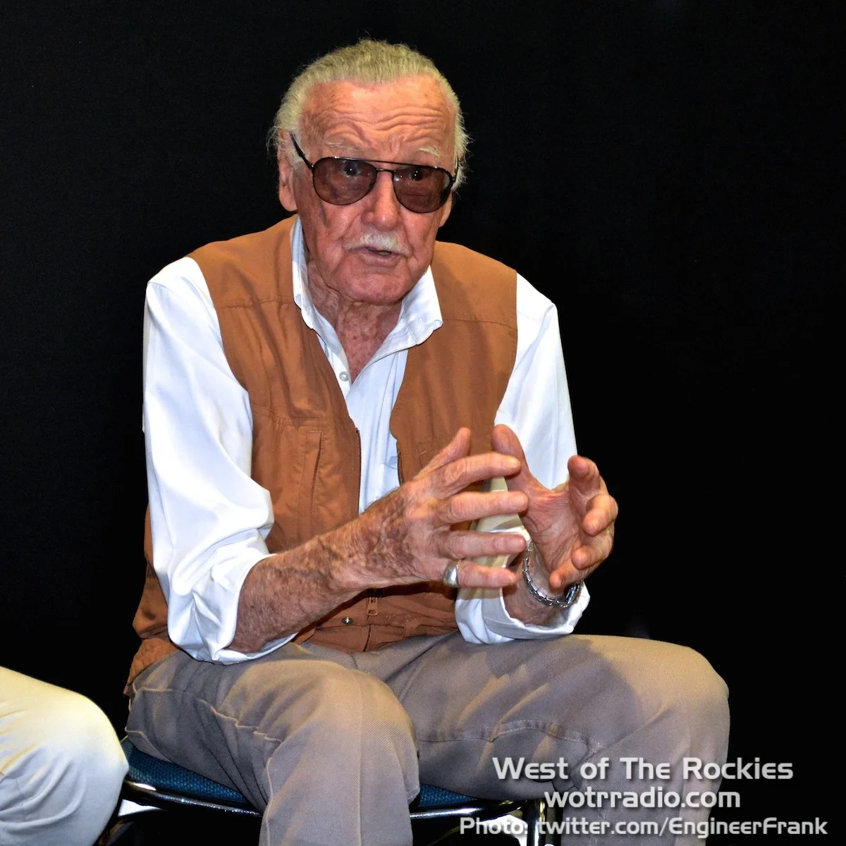 Stan Lee at the SLKU press conference, animatedly describing their upcoming children's publications. 