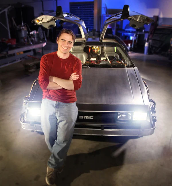 Steve Concotelli, standing proudly by the restored DeLorean.