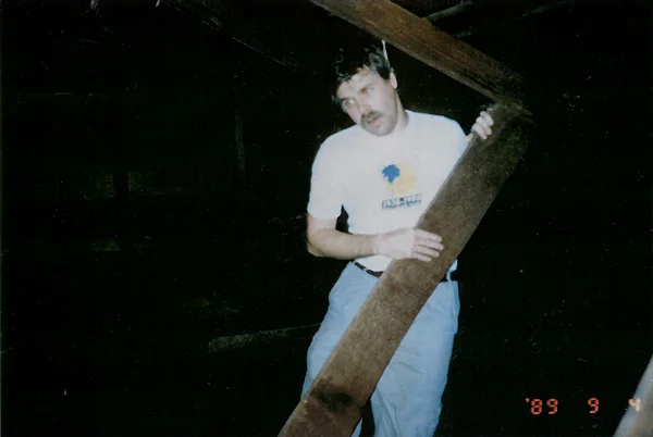 One of the photos taken at the Hernandez house, capturing Jeff Wheatcraft just moments after a cord was wrapped around his neck in the attic and hung from the rafters. Photo by Larry Brooks, courtesy of BarCon Productions.