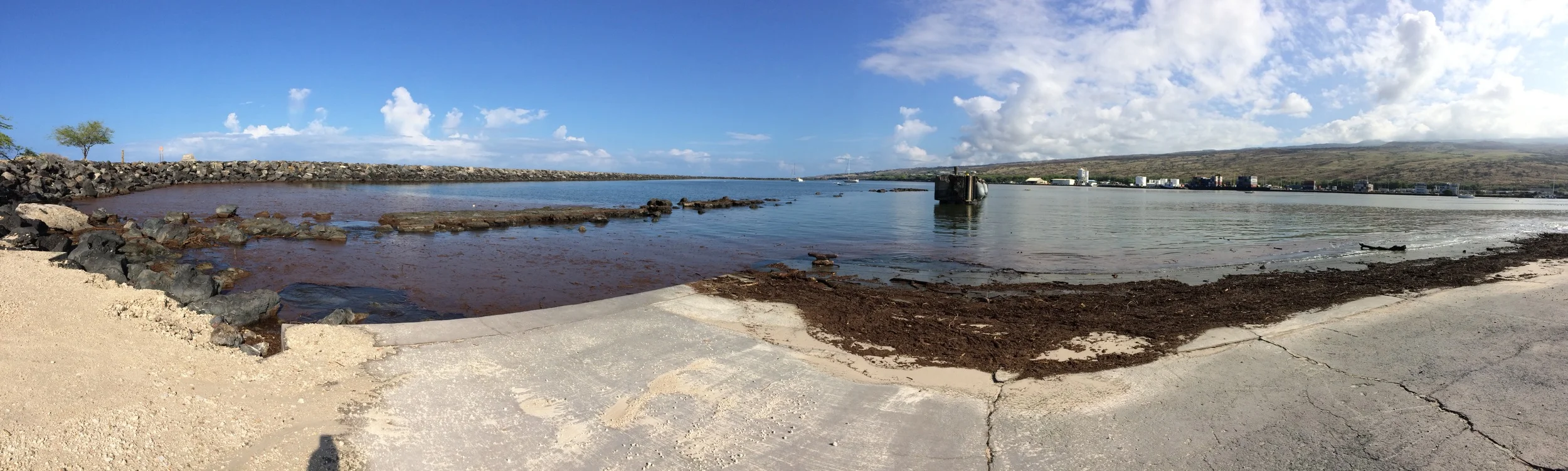 Panorama of post-fire debris covering Kawaihae Harbor.