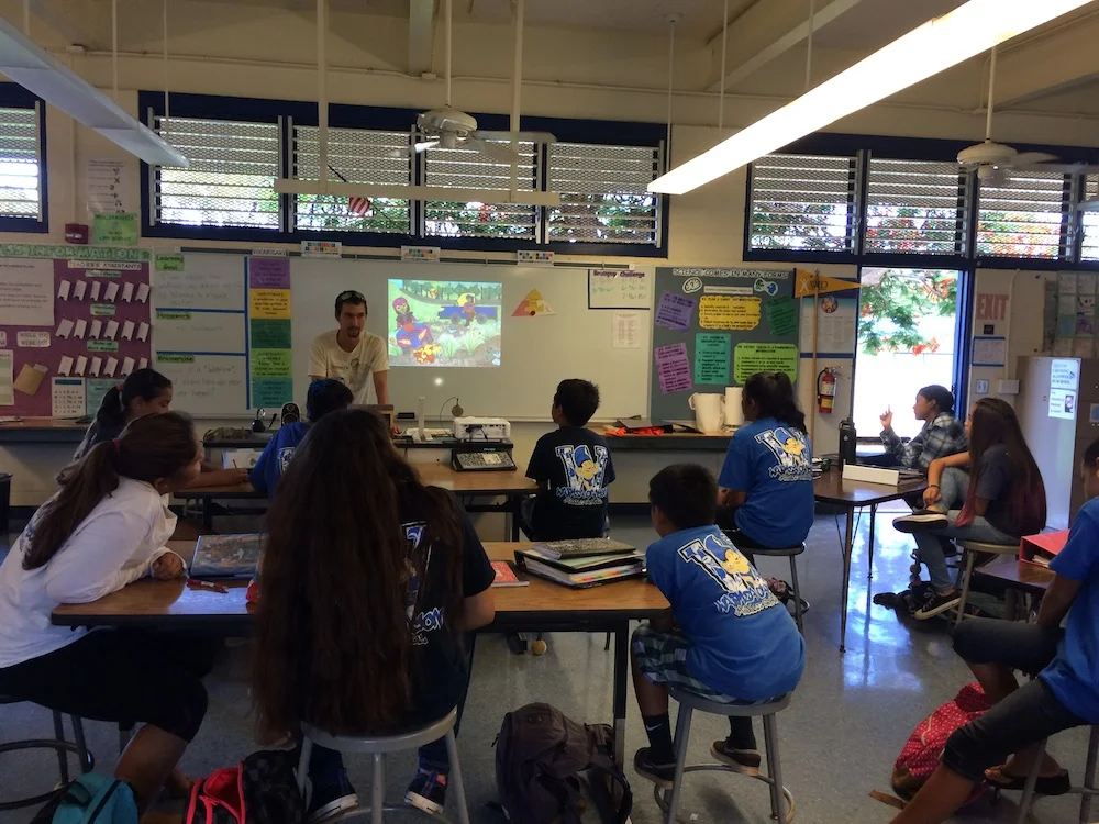 Pablo asks students to chime in on how the wildfire hazards on the screen could be eliminated.