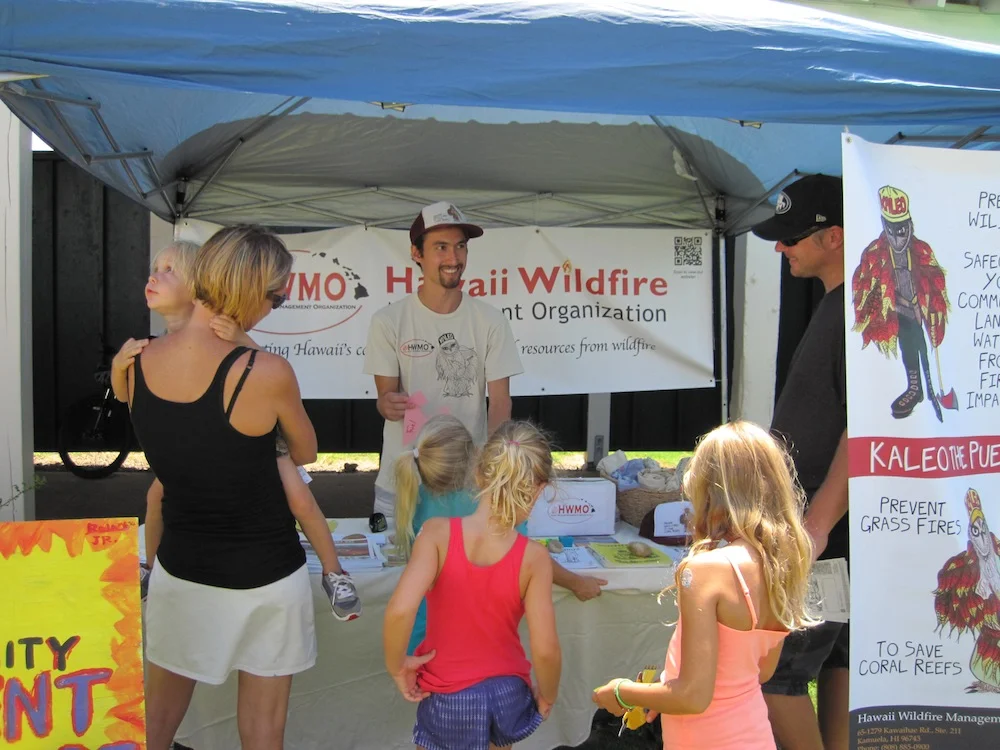 Family stops by to learn components of the fire triangle.