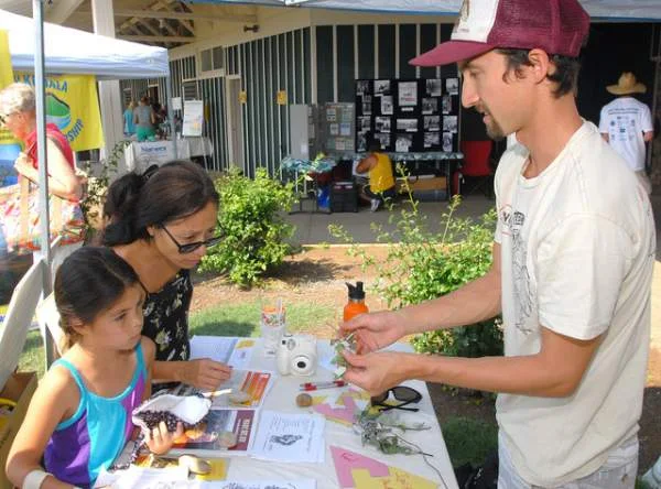 Our booth was featured in West Hawaii Today's photo gallery of the Wiliwili Festival 2015. "Pablo Beimler of the Hawaii Wildfire Management Organization, right, offers a pohinahina start to Mia Wright and her daughter Kara at the Wiliwili Festival sponsored by the Waikoloa Dry Forest Initiative Saturday at Waikoloa Stables. Laura Shimabuku/West Hawaii Today"