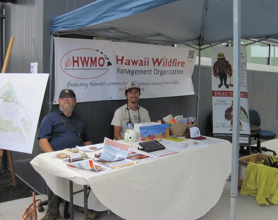 HWMO's Sam Patten (left) and Pablo Beimler (right) hold down the booth for the day.