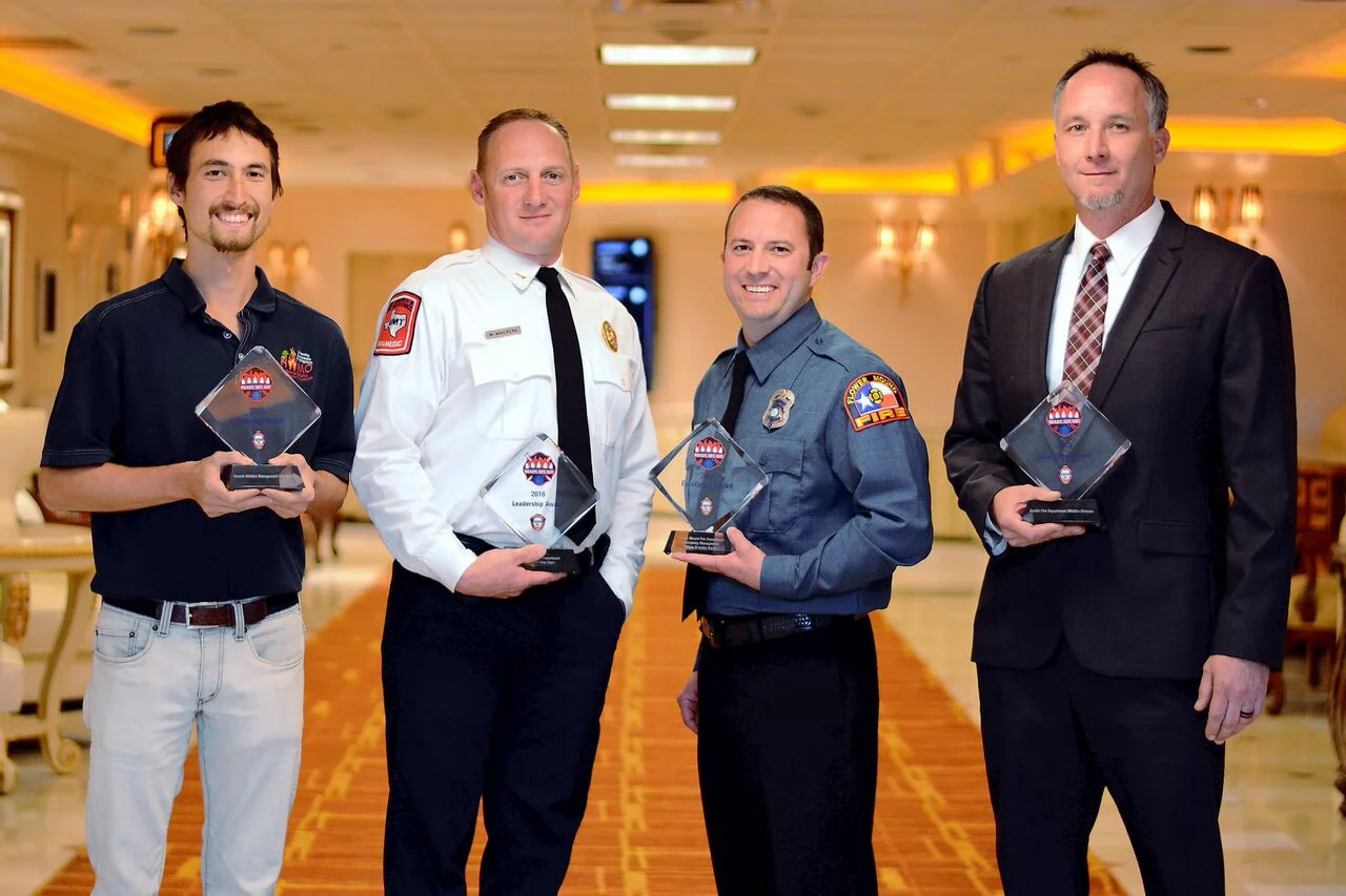 Pablo Beimler (left) representing HWMO poses with other winners of the RSG! Awards: Aubrey FD, Flower Mound FD, and Austin FD.