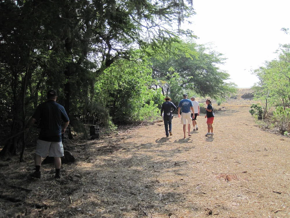 Waialea residents and homeowners walk along a fire access road that splits the living fuelbreak.