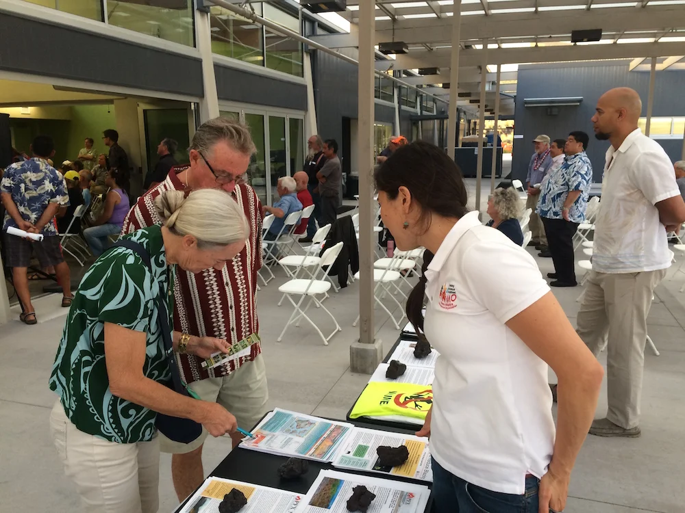 Melissa Kunz (HWMO/PFX) talks to community members at the outreach table.