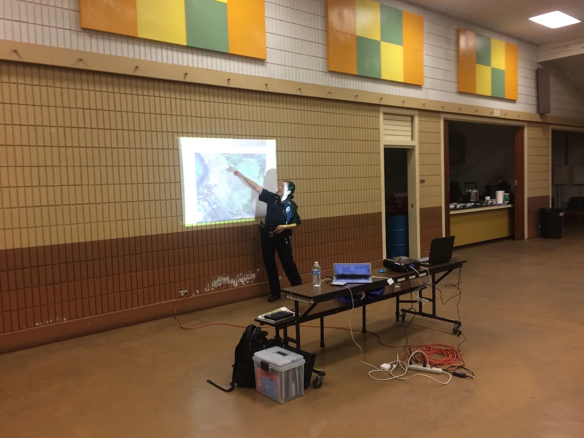 Officer May Lee giving a presentation to Puu Kapu Neighborhood Watch.
