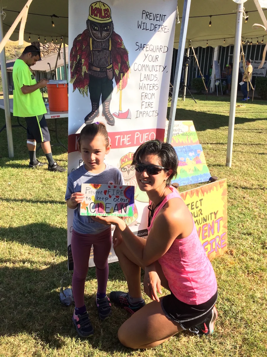 Young artist creates a beautiful "Prevent Fires to Keep Ocean Clean" sign.