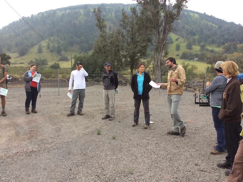 Starting the field tour in a circle at the baseyard at the foot of Puʻu Waʻawaʻa