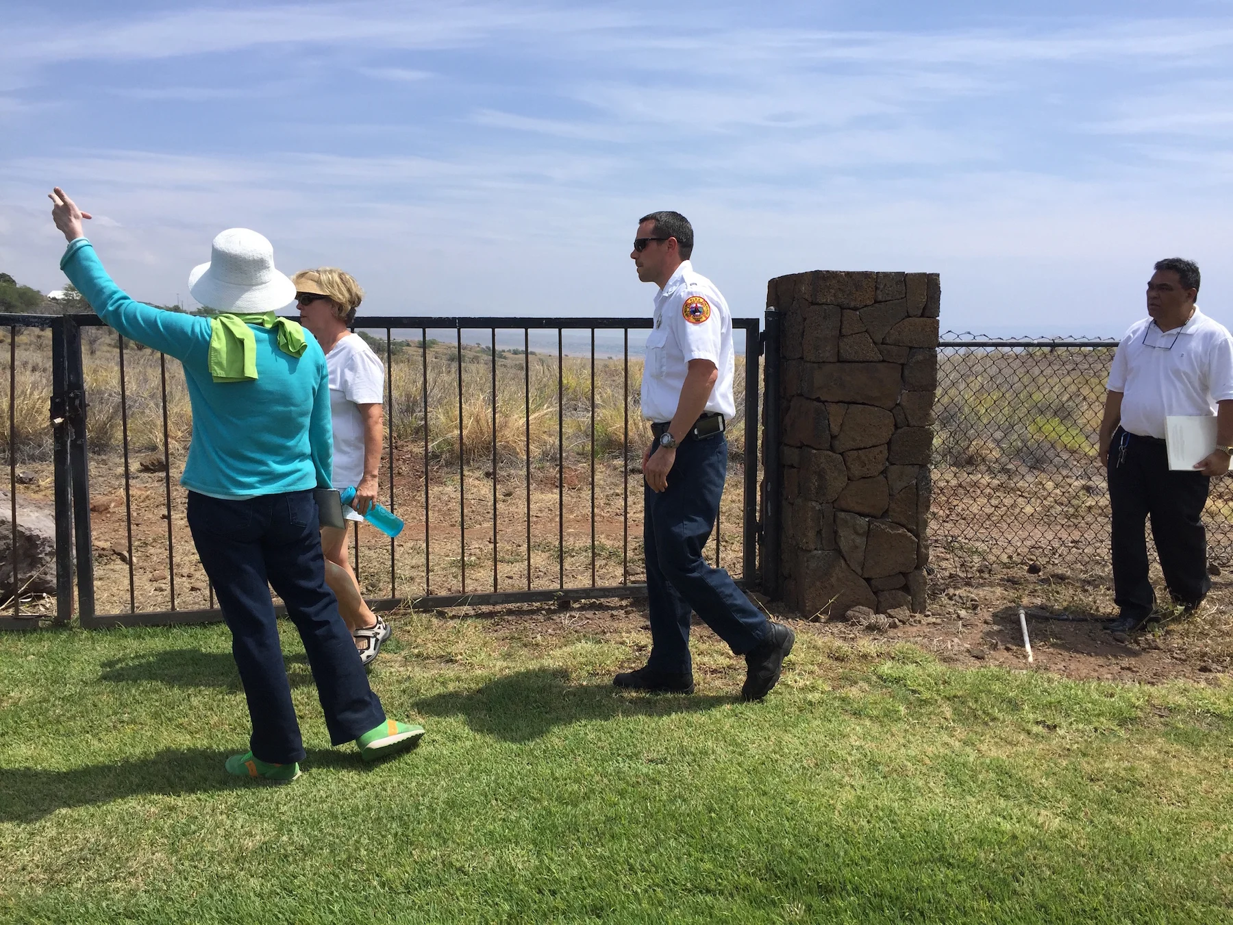 Walking the Kohala Waterfront perimeter to examine wildfire hazards.