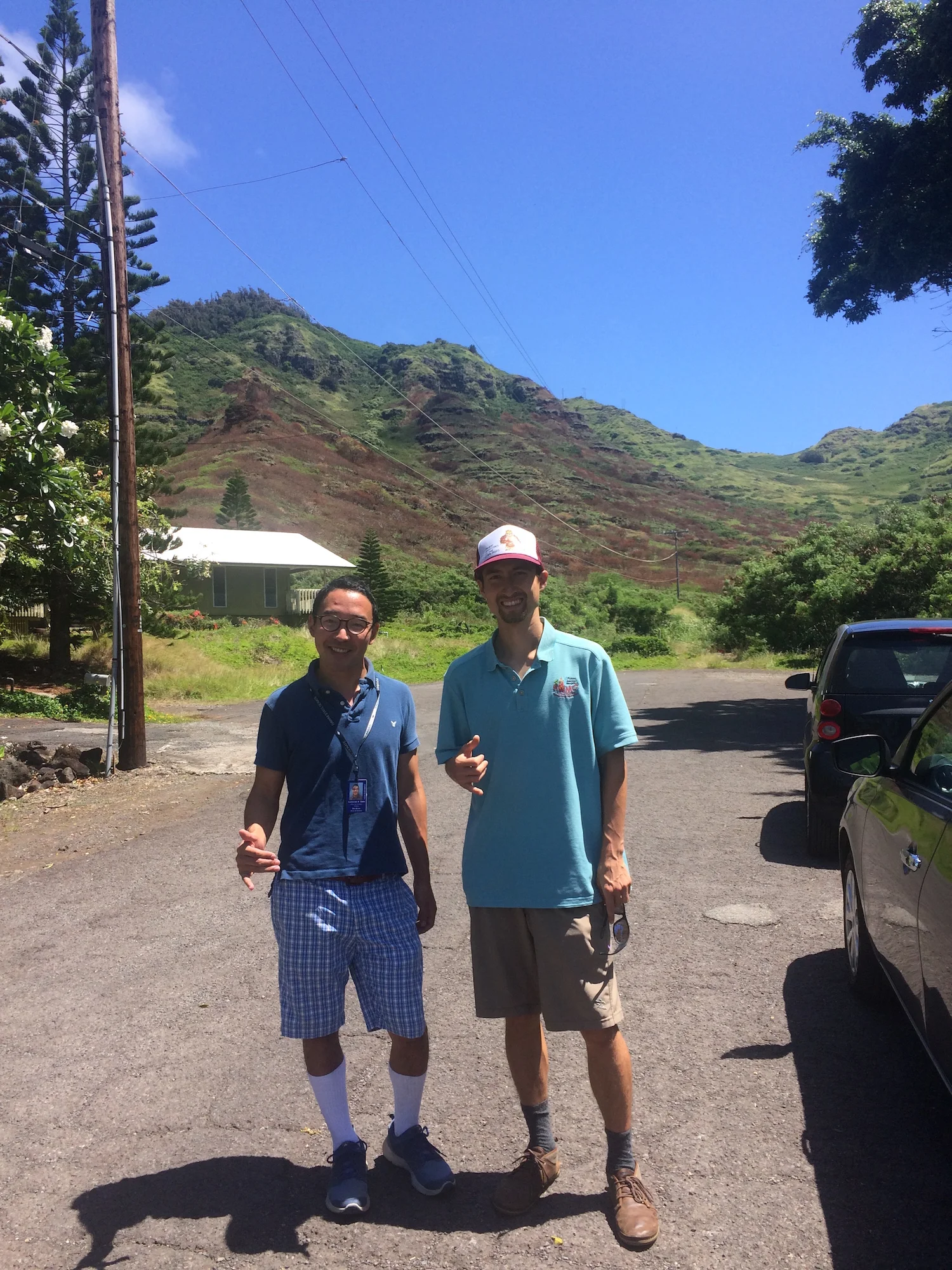 Cameron Sato (left), Office of Senator Stanley Chang, and Pablo Beimler (right), HWMO in front of Kamilonui Valley burn scar.