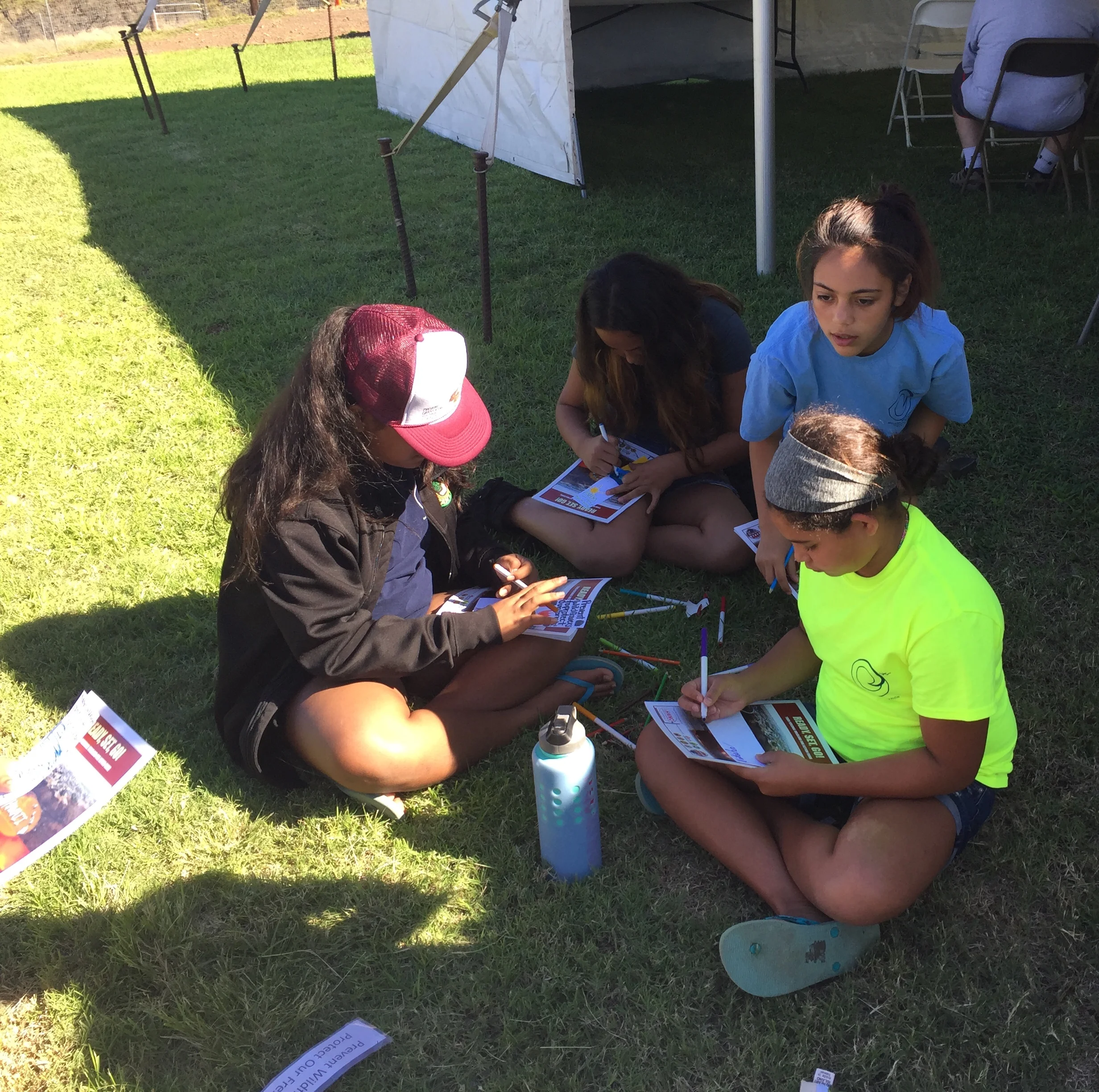 Ocean Warriors hard at work designing their creative prevent wildfire bookmarks.