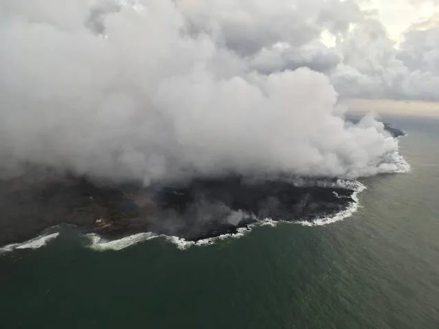 "This photo of the western margin of the lava flow at the oceanfront was taken Sunday. The western flow margin did not advance overnight, and remained approximately 0.1 mile from the Pohoiki Boat Ramp at Isaac Hale Beach Park this morning." Credit: USGS