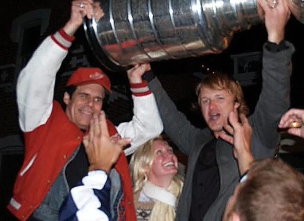 Kelly "Mr. Chill" Hoppe and Aaron's wife Heather hoisting the Stanley Cup after performing at Detroit Red Wing Aaron Downey's Stanley Cup party in 2008.