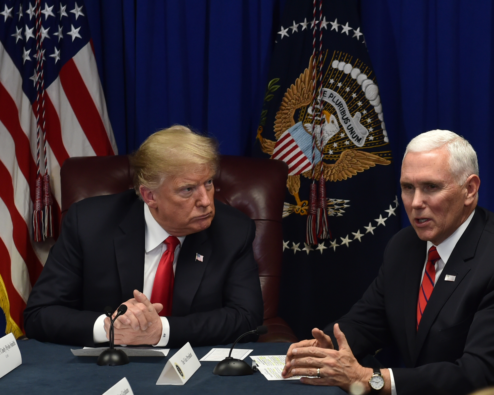 Seated next to President Donald Trump, Vice president Mike Pence speaks to members of a roundtable on criminal justice reform initiatives held at the Mississippi Air National Guard base in Gulfport in advance of an evening rally in Biloxi supporting