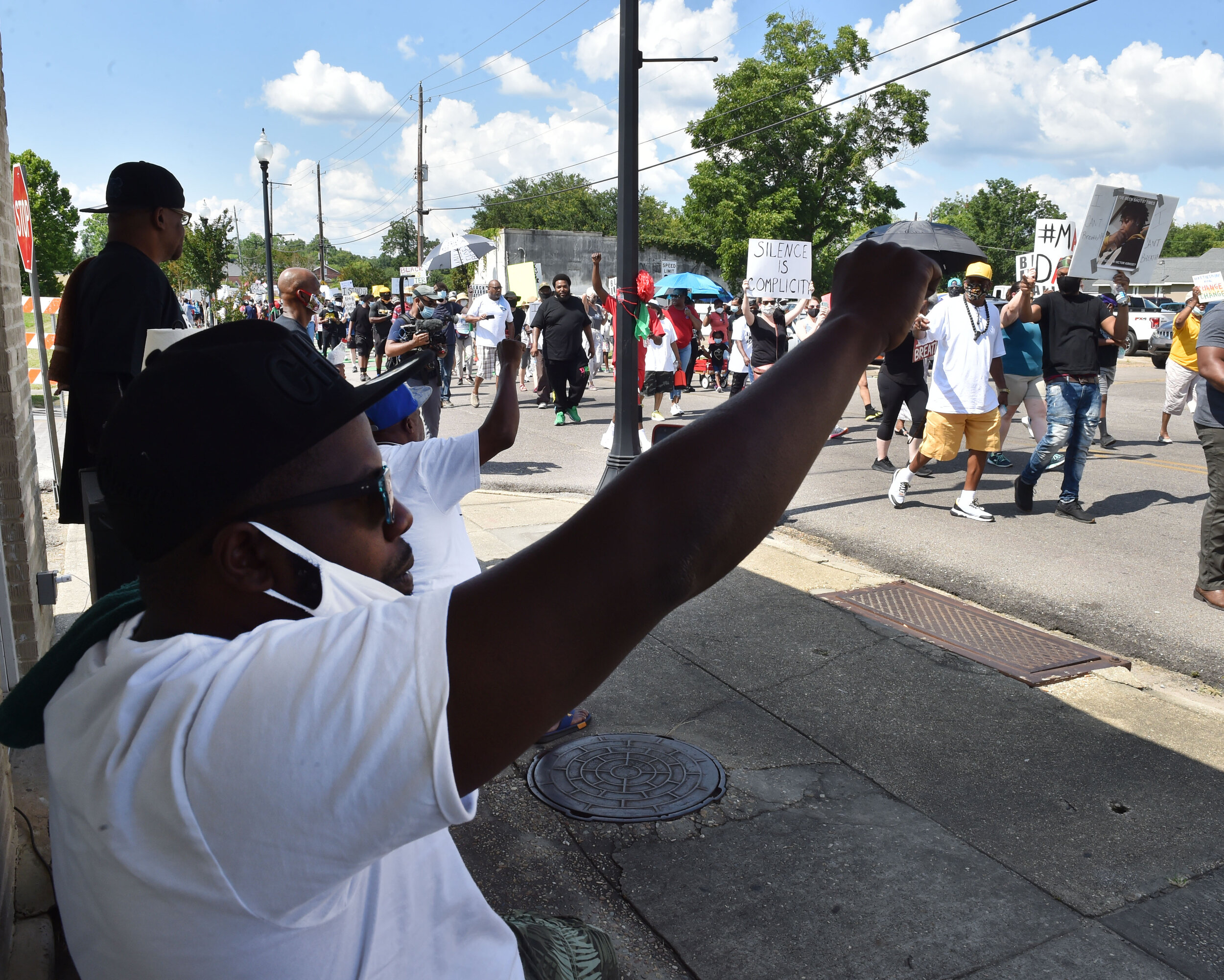 People march in Hattiesburg, Miss., protesting against police brutality on Saturday, June 13, 2020. The event, organized by Black Lives Matter, follows a wave of protests across the state and country after the death of George Floyd during his arrest