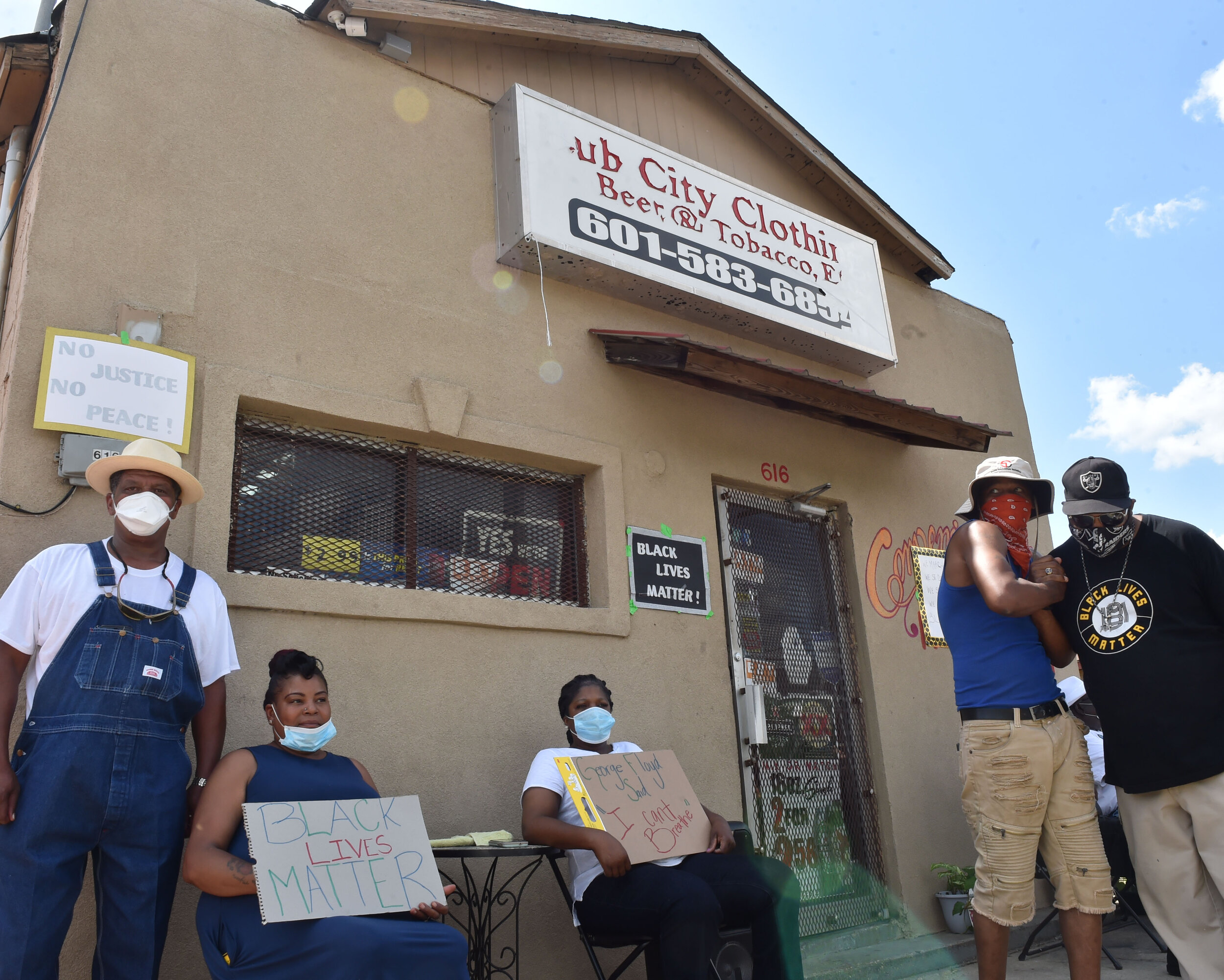 Participants and observer mingle out site the Hub City store during a Black Lives Matter demonstration on Saturday, June 13, 2020 in Hattiesburg, MS.