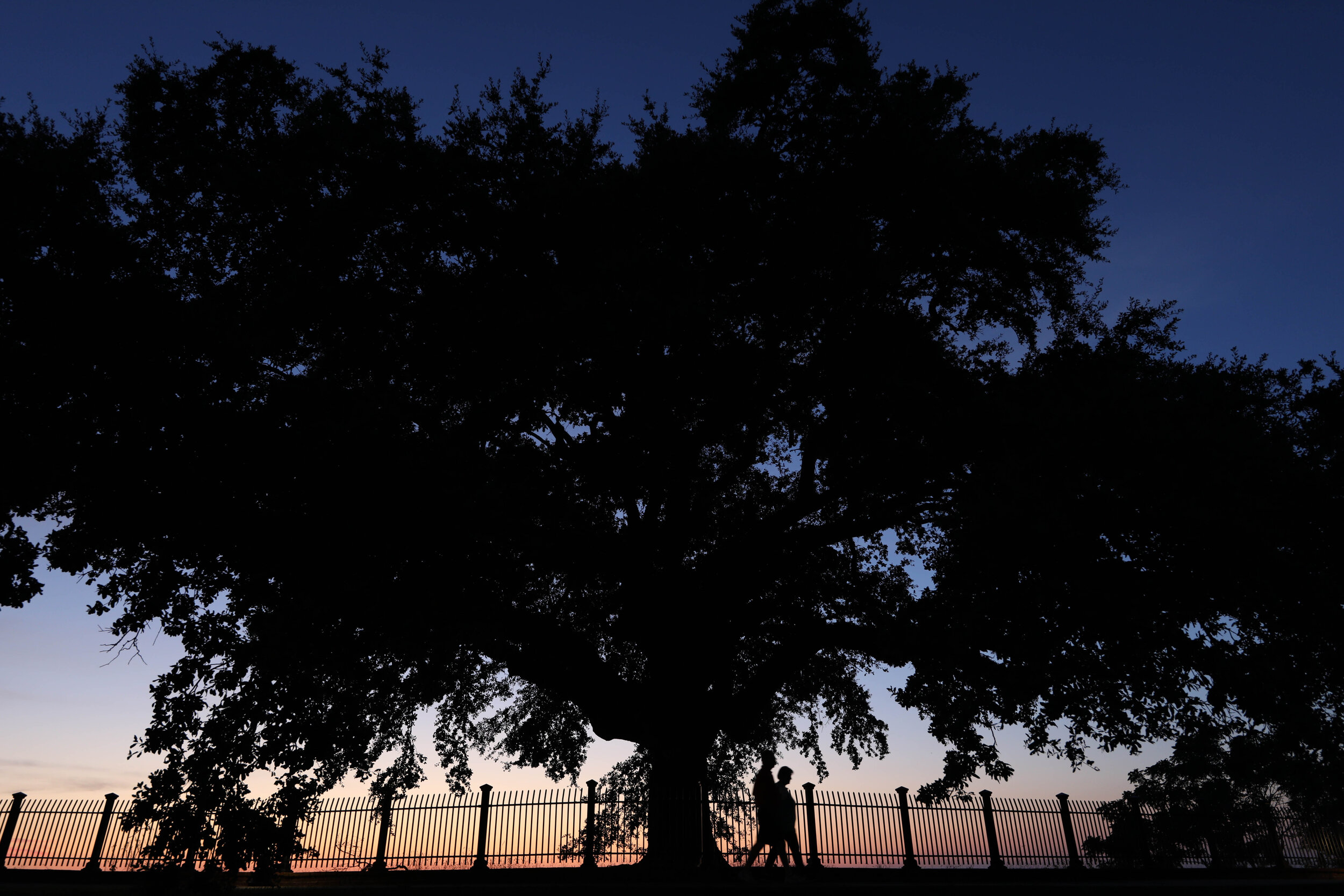 A couple takes a stroll along the bluffs above the Mississippi River in in Natchez, MS. July, 2020.