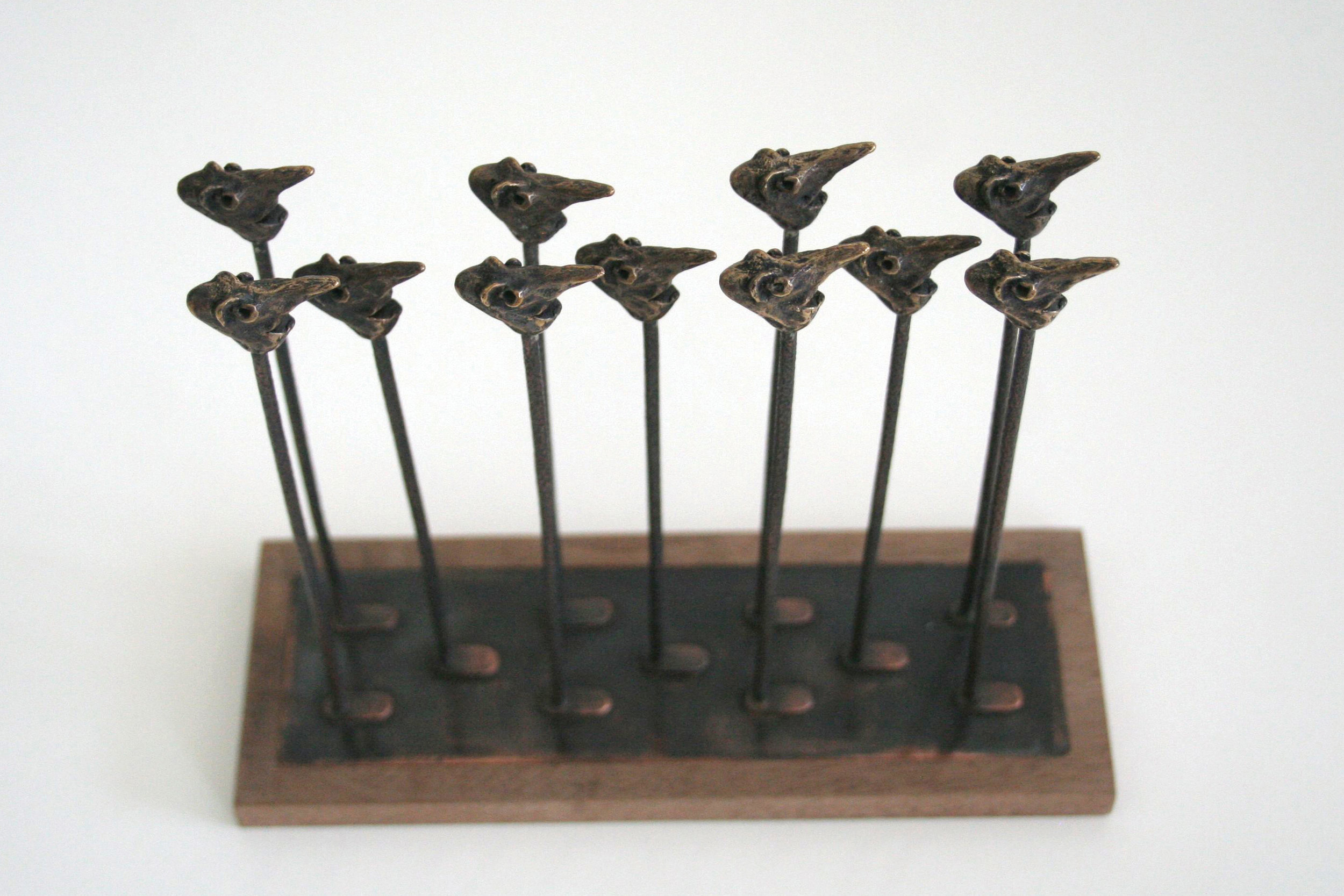  bronze, copper, hardwood base  5.9” x 6.65” x 2.45” 