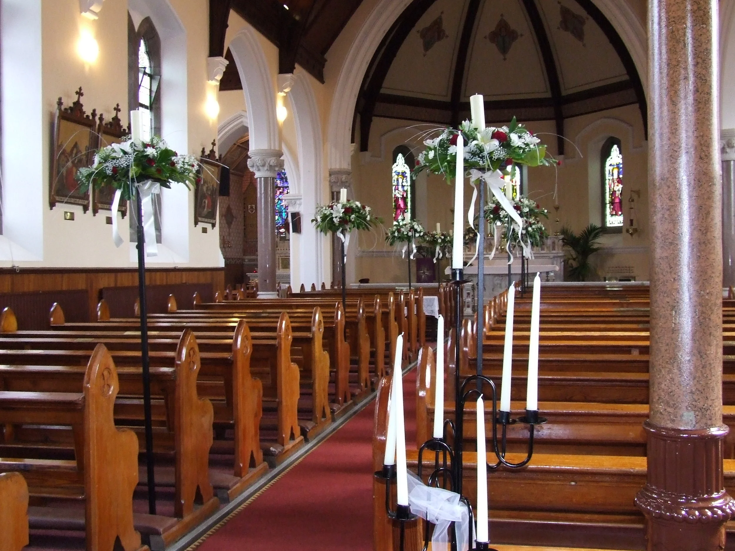 Elegance!   Stunning tall elegant floral arrangements down the aisle.  Always creates the Wow factor!