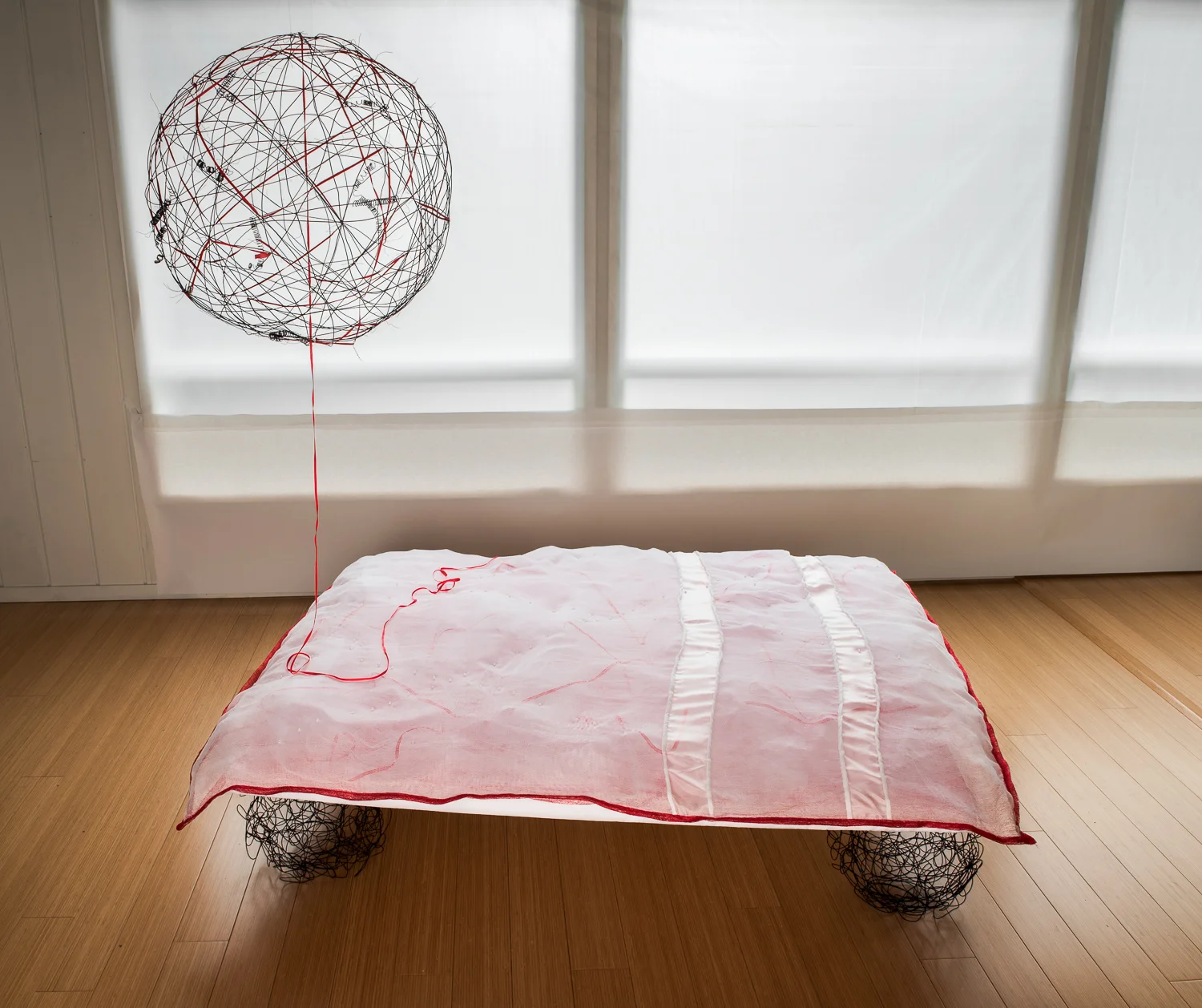 Matrimonial Bed with Shared Galaxy:
0
false
18 pt
18 pt
0
0
false
false
false
/* Style Definitions */
table.MsoNormalTable
{mso-style-name:"Table Normal";
mso-tstyle-rowband-size:0;
mso-tstyle-colband-size:0;
mso-style-noshow:yes;
mso-style-parent:"";
mso-padding-alt:0cm 5.4pt 0cm 5.4pt;
mso-para-margin-top:0cm;
mso-para-margin-right:0cm;
mso-para-margin-bottom:10.0pt;
mso-para-margin-left:0cm;
mso-pagination:widow-orphan;
font-size:12.0pt;
font-family:"Times New Roman";
mso-ascii-font-family:Cambria;
mso-ascii-theme-font:minor-latin;
mso-hansi-font-family:Cambria;
mso-hansi-theme-font:minor-latin;} Coverlet/Mattress: Cotton butter cloth, habotai silk top, tulle batt, ribbon, ‘pearls,’ red poly spider writing backing, hand sewn. Box Spring: Styrofoam support, nylon cover. Spherical ‘legs’: rebar tie wire. 58” x 48” (147 cm x 122 cm), 2015