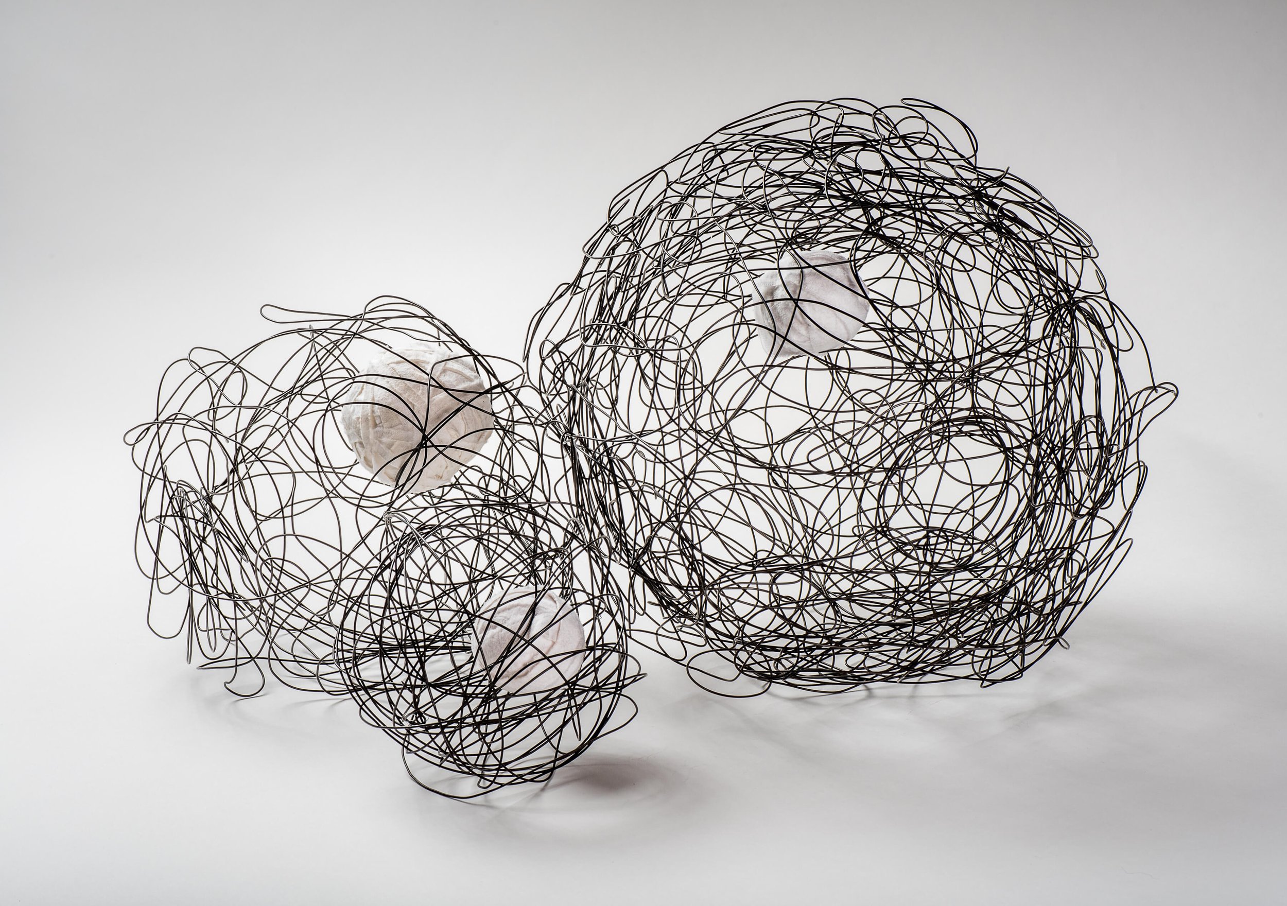 THREE GALAXIES

Rebar tie wire, white selvedge edge ball.  Large: 14 ½” (37cm) dia., Medium: 10” (26cm) dia.,Small: dia. 6” (15 cm) dia. 2015