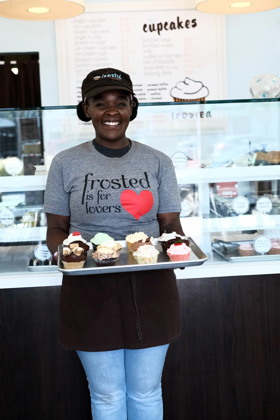 Pictured: Brittany Clarke with a delicious tray of Frosted Cupcakery treats!!!
