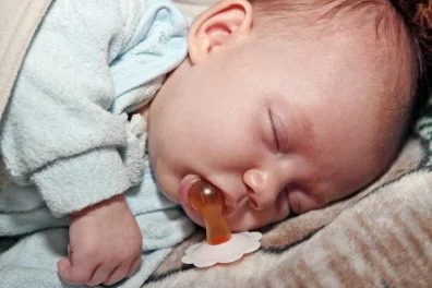 cutcaster-902847669-sleep-with-a-pacifier-small.jpg