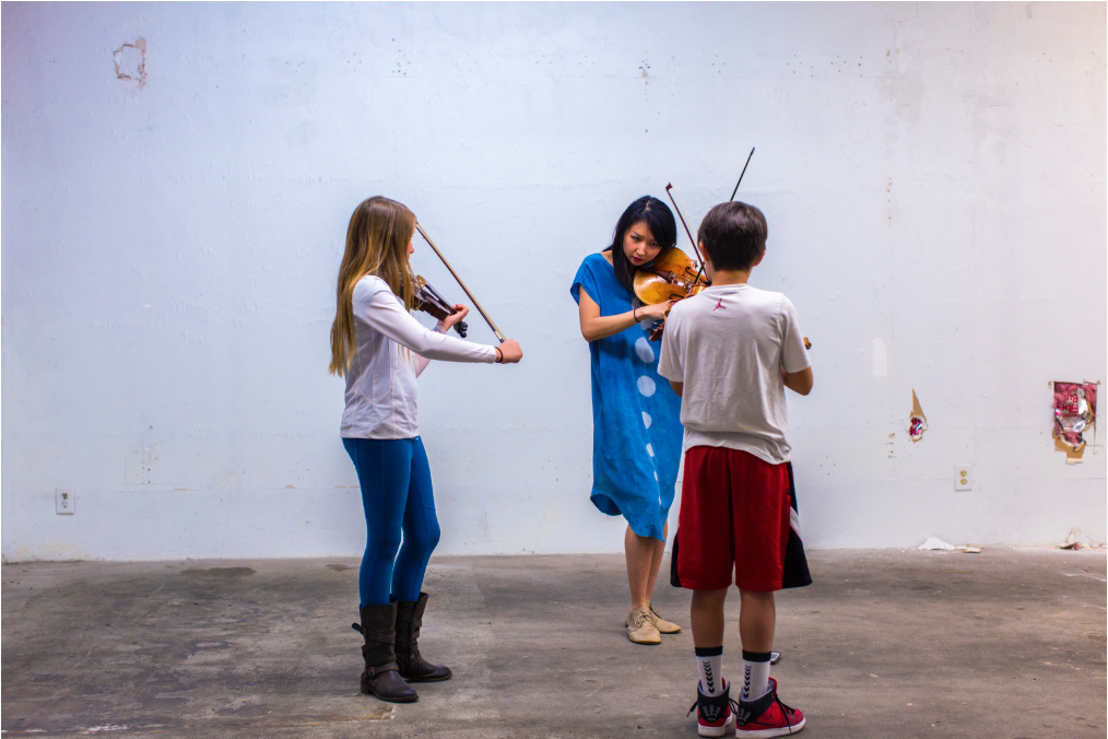  Mario teaching a hip-hop workshop for students  