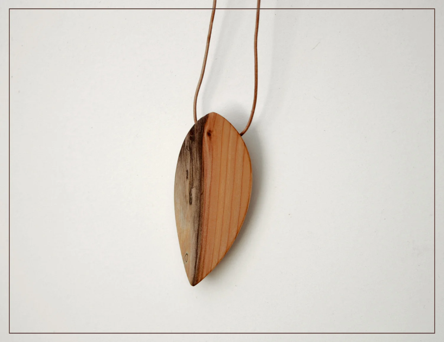 Small variegated yew leaf pendant