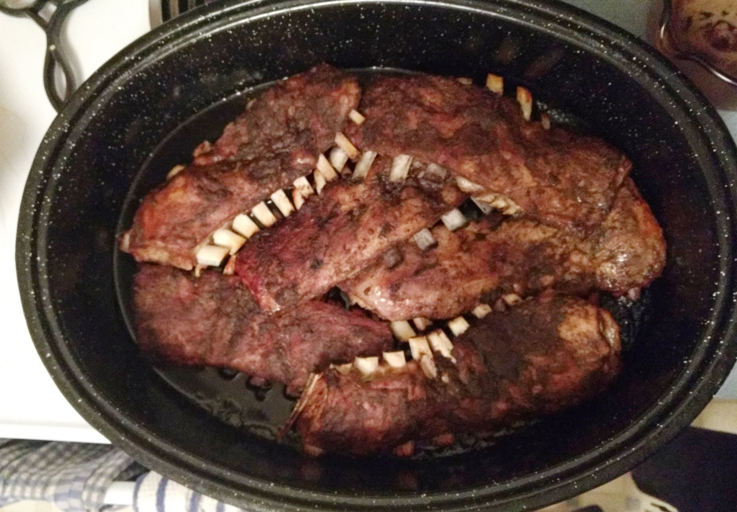 4. For the last half hour uncover and cook uncovered adding a bit of broth if the pan is too dry. 5. Cut into 2 or 3 rib portions. Plate and serve with y our favorite chopped salad or slaw.