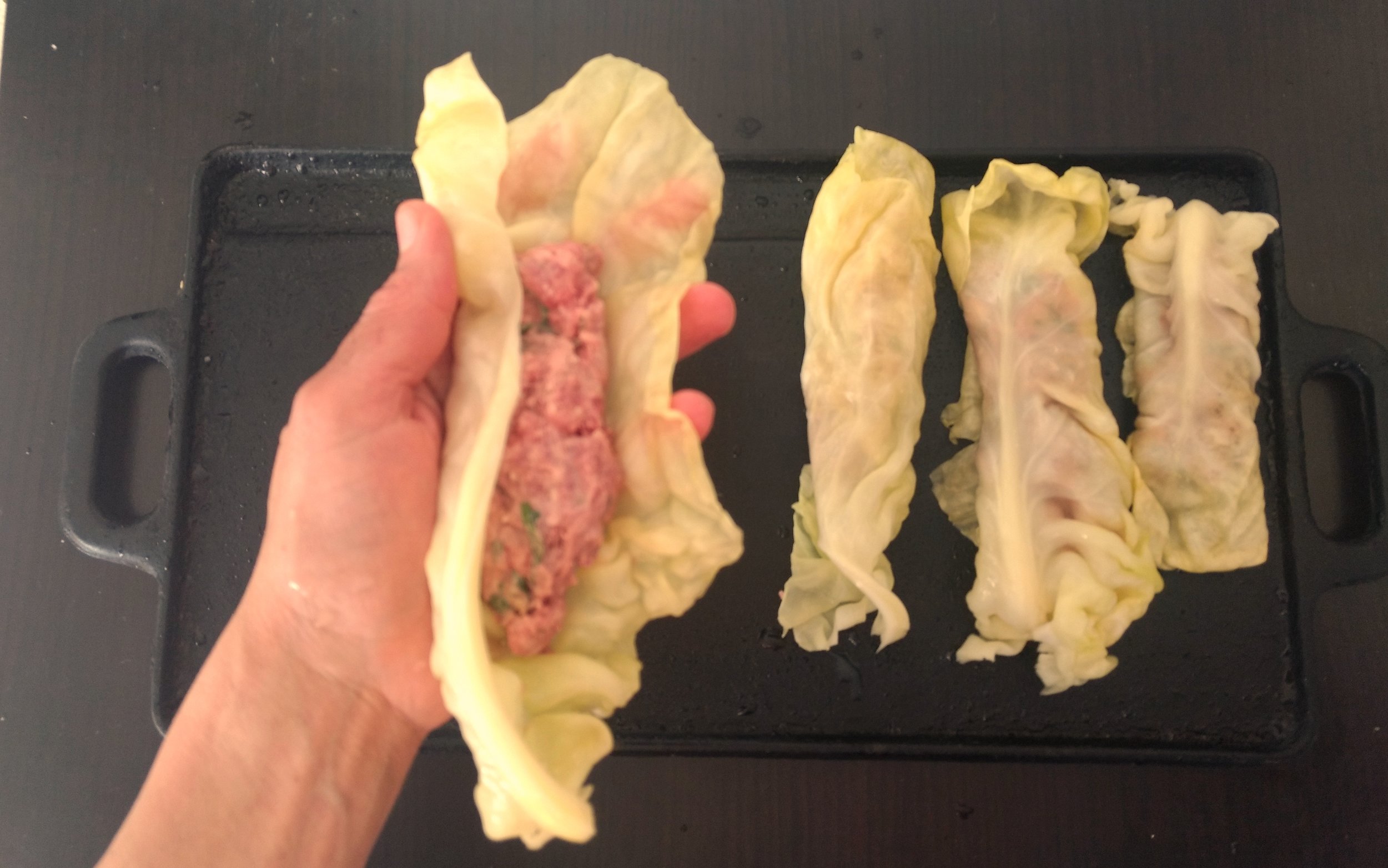 Assemble the rolls: 1-Spoon meat mixture into the center of each leaf, then roll the leaves tightly to form logs. Fold and tuck the ends to seal, if desired.