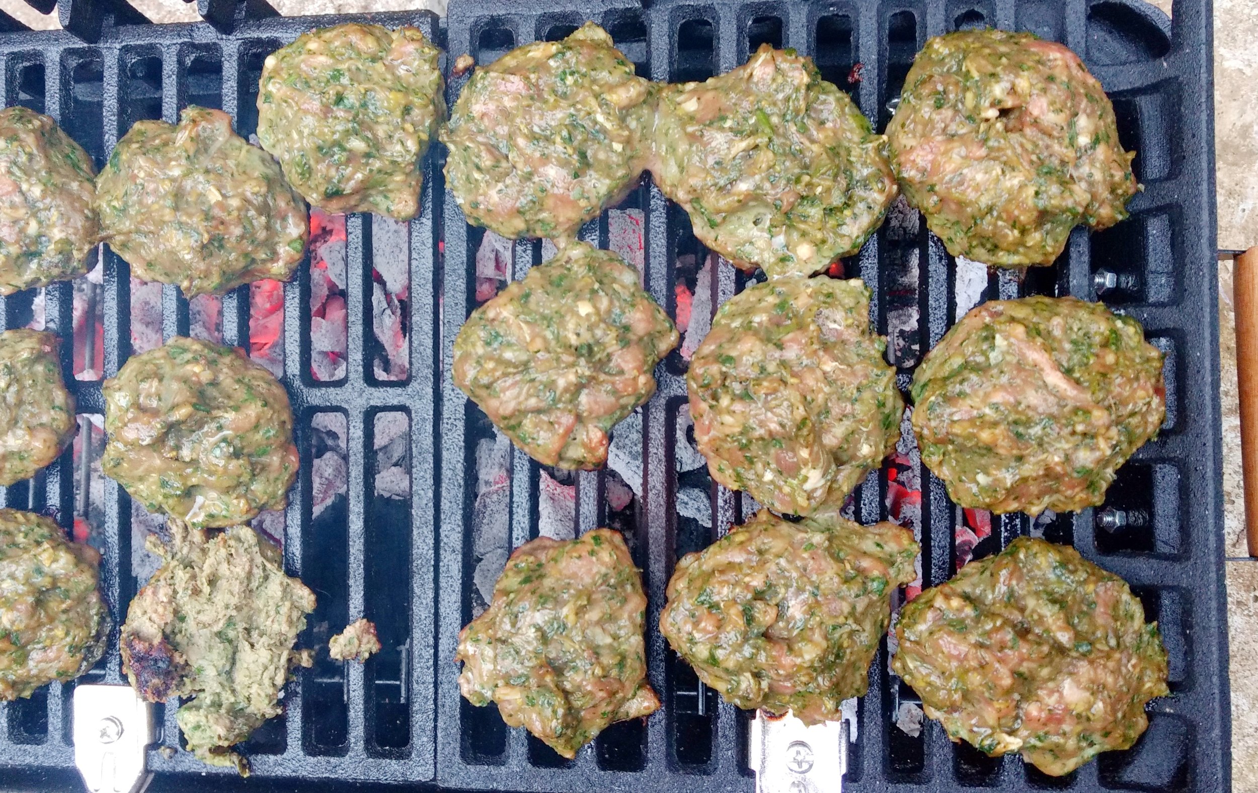 6- Or prepare a medium-hot fire in a charcoal grill or preheat a gas grill (we use the habachi pictured above). Grill the patties for about 4 minutes per side, or until done as you like. Serve with cauliflower rice and veggies sides. I made a fermented carrot salad and lemon radishes.
